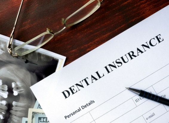 Paperwork on table for dental insurance in York