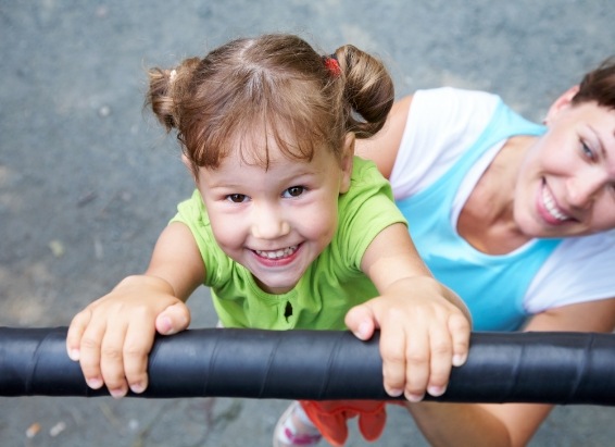 Young girl playing on playground after children's dentistry in York