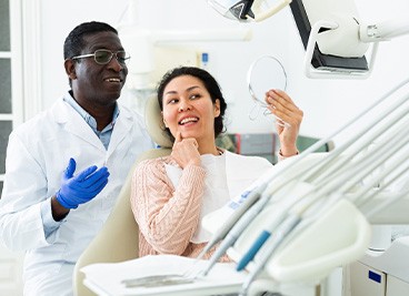 Woman smiling in the dental chair