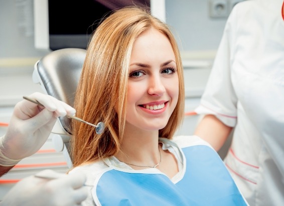 Young blonde woman smiling in dental chair