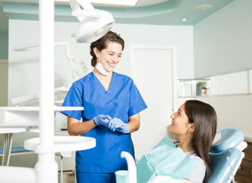 Patient in York talking to dentist about dental implants