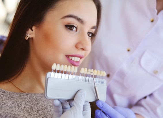 Young woman getting dental veneers from her cosmetic dentist
