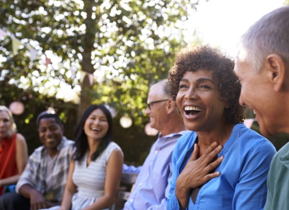 Group of adults laughing together outdoors