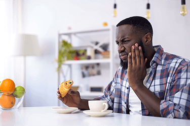 Man with tooth sensitivity