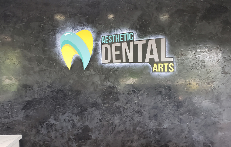 Aesthetic Dental Arts sign on wall